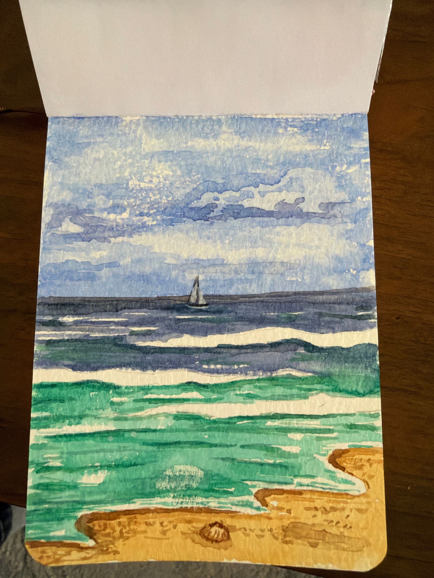 Seascape watercolor with the sailboat and the shell added
